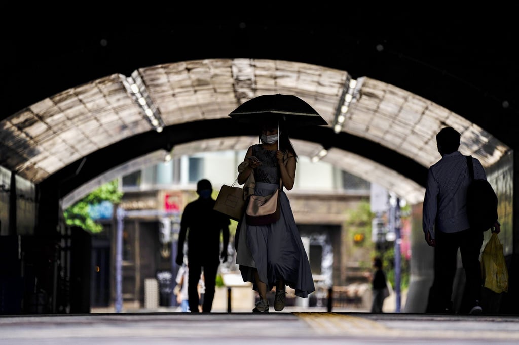 Commuters at a train station in Tokyo on July 11. The fourth state of emergency for Tokyo took effect on July 12 and would last through August 22, despite the opening ceremony of Tokyo Olympics that’s scheduled to be held in less than two weeks. Photo: AP