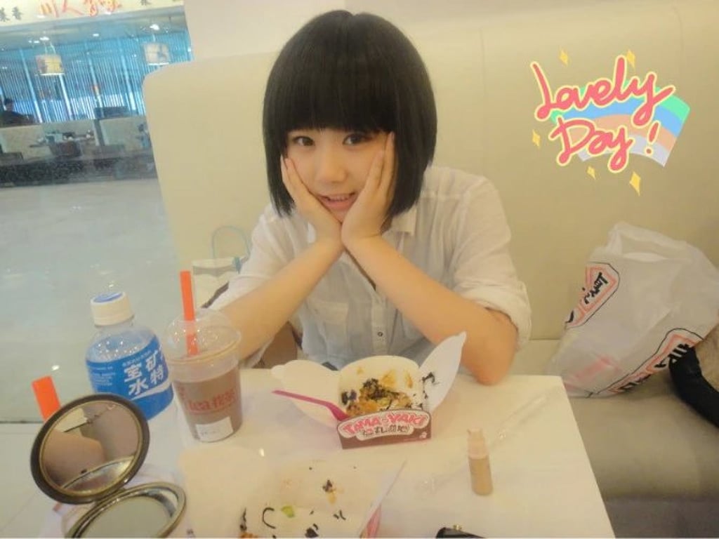 Feng, six months post-recovery and back to school, wearing a wig. Photo: Chloe Feng