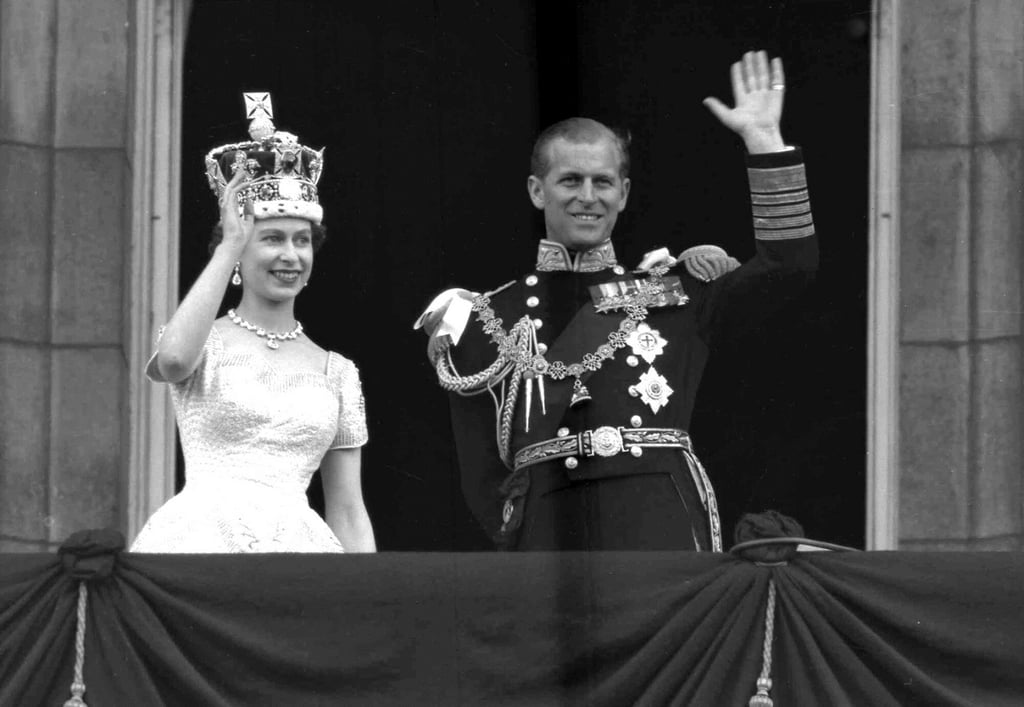 Britain’s Queen Elizabeth and her husband, the Duke of Edinburgh, wave from the balcony of Buckingham Palace, London, following the queen’s coronation at Westminster Abbey in June 1953. Photo: AP Photo