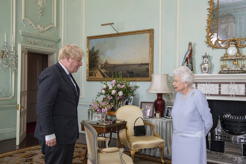 Britain’s Queen Elizabeth greets Prime Minister Boris Johnson at an audience at Buckingham Palace, London. Photo: AP