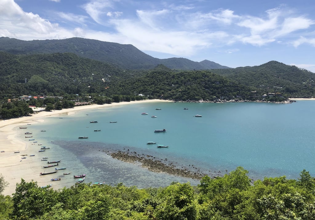 Fishing vessels and boats, typically used to ferry tourists, sit idle off the popular tourist island of Koh Phangan, Thailand, in July 2020. Photo: AP Photo