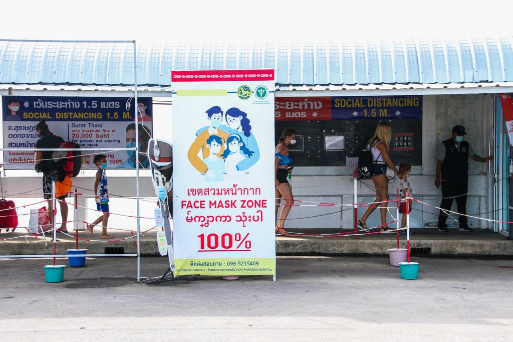 Tourists arrive via ferry into Koh Phangan, Thailand, on July 21, 2021. Photo: Tommy Walker