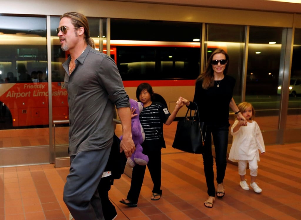 Brad Pitt and actress Angelina Jolie arrive with their children Knox, Vivienne and Pax at Haneda international airport in Tokyo, Japan, in July 2013. Photo: Reuters