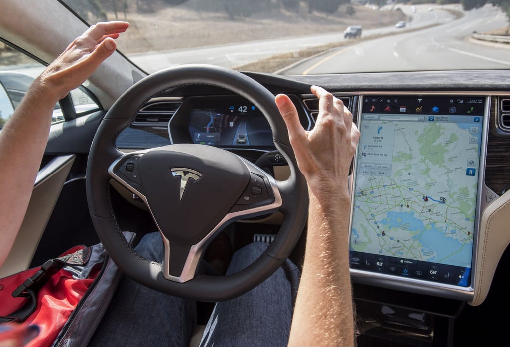 A member of the media test drives a Tesla Motors Inc. Model S car equipped with Autopilot in Palo Alto, California, US, in October 2015. Photo: Bloomberg A member of the media test drives a Tesla Motors Inc. Model S car equipped with Autopilot in Palo Alto, California, US, in October 2015. Photo: Bloomberg