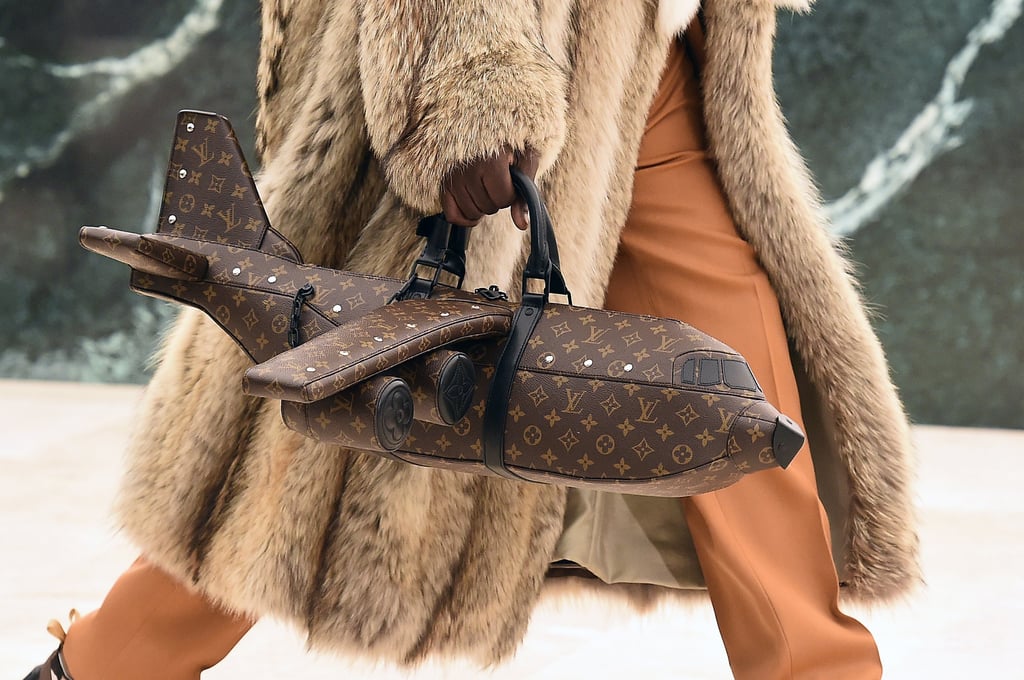 A model walks the runway with a plane-shaped handbag during the Louis Vuitton menswear autumn/winter 2021-2022 show as part of Paris Fashion Week, on January 20. Photo: WireImage for ABA A model walks the runway with a plane-shaped handbag during the Louis Vuitton menswear autumn/winter 2021-2022 show as part of Paris Fashion Week, on January 20. Photo: WireImage for ABA