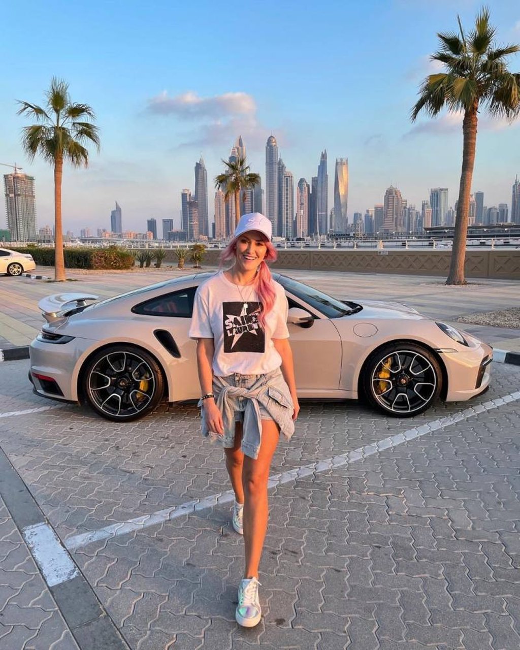 Alex Hirschi, known online as Supercar Blondie, posing with a luxury car. Photo: @supercarblondie/Instagram Alex Hirschi, known online as Supercar Blondie, posing with a luxury car. Photo: @supercarblondie/Instagram