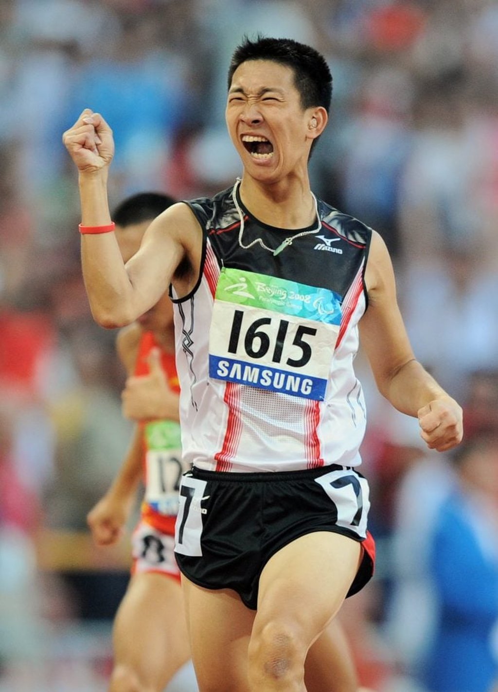 So Wa-wai celebrates after winning the final of the men’s 200 metre T36 classification event at the 2008 Beijing Paralympic Games. Photo: AFP So Wa-wai celebrates after winning the final of the men’s 200 metre T36 classification event at the 2008 Beijing Paralympic Games. Photo: AFP