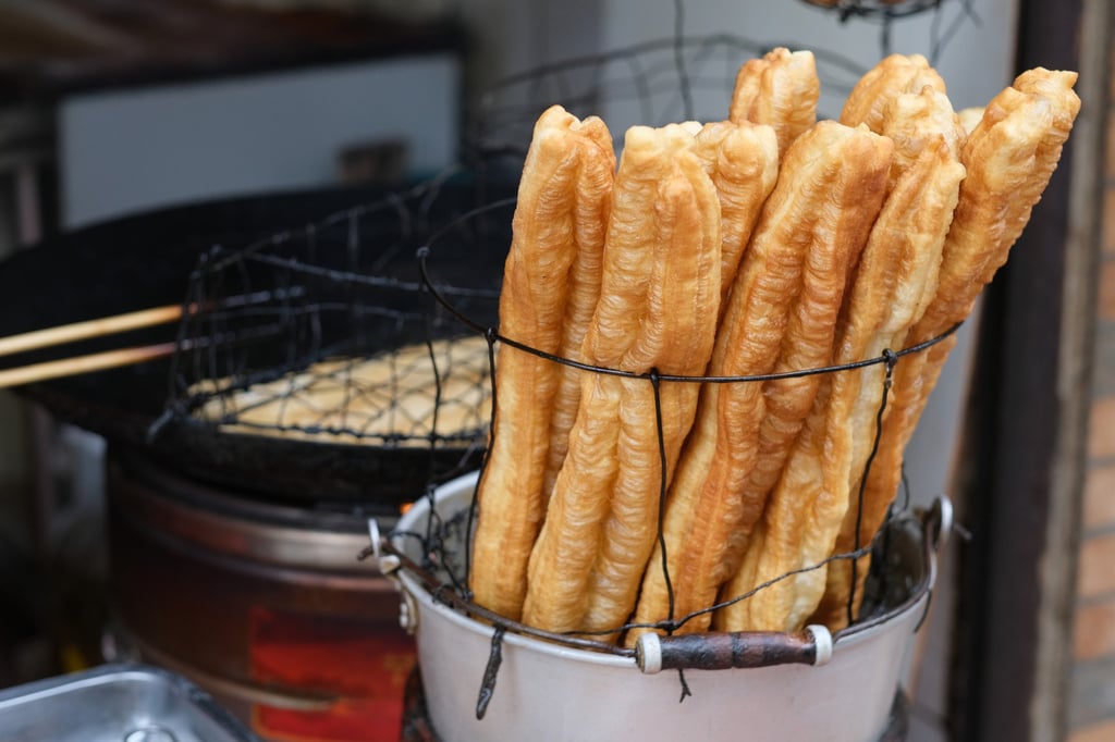 Deep-fried dough sticks, or youtiao, are a famous traditional snack in China. Photo: Shutterstock
