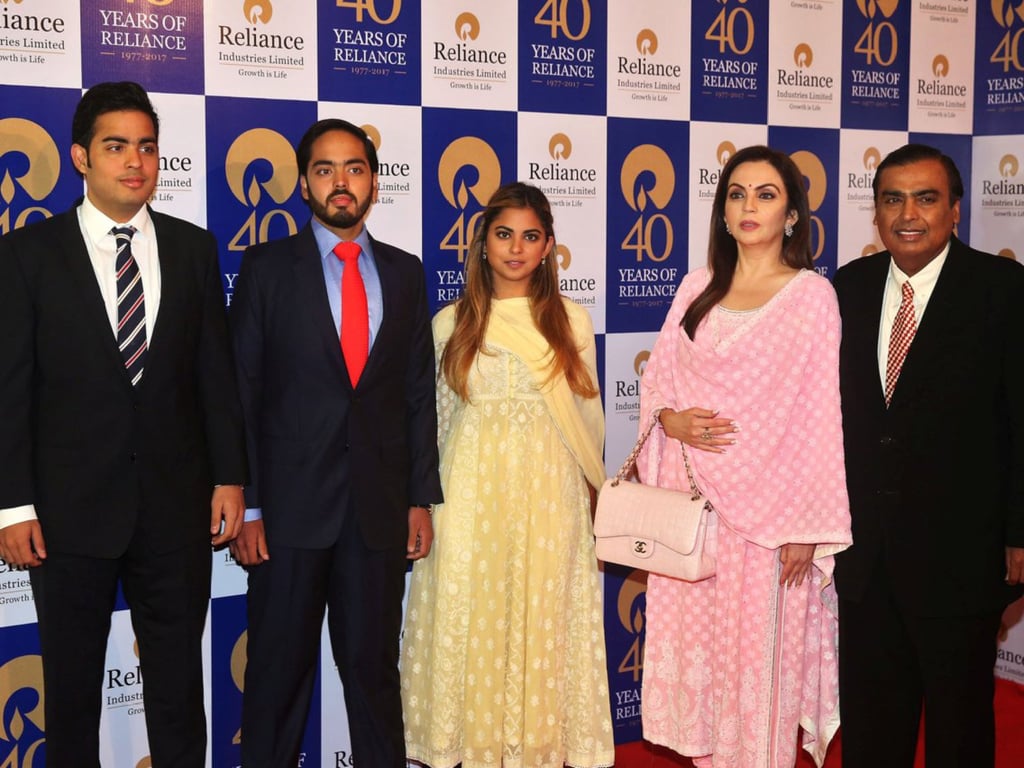 The Ambanis, from left to right: Akash, Anant, Isha, Nita and Mukesh. Photo: Reuters The Ambanis, from left to right: Akash, Anant, Isha, Nita and Mukesh. Photo: Reuters