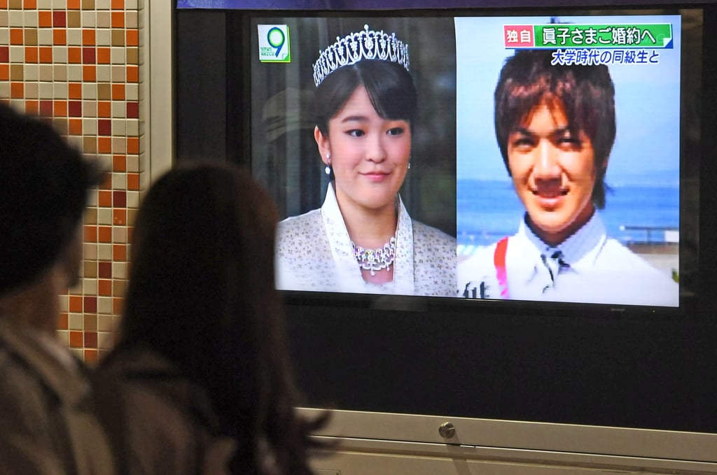A street TV in Tokyo’s Yurakucho area shows a news report saying that Princess Mako, the first grandchild of Japanese Emperor Akihito, will soon become engaged to Kei Komuro, a 25-year-old graduate student at Tokyo’s Hitotsubashi University, in May 2017. Photo: Kyodo