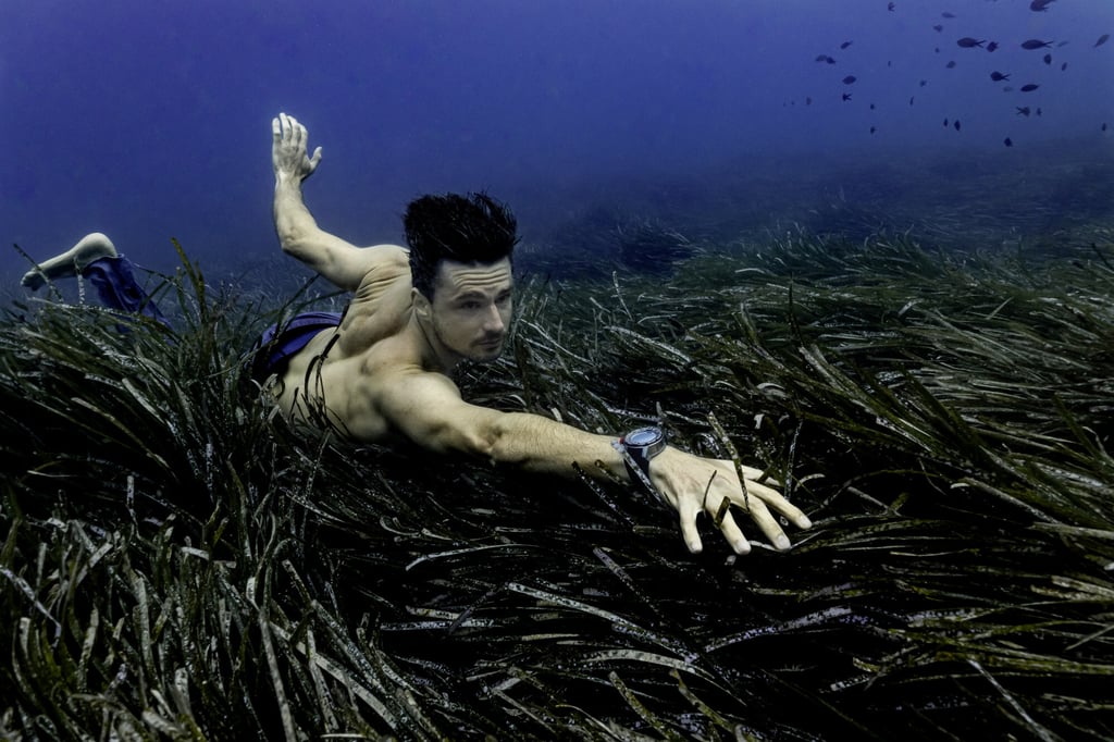 Arnaud Jerald broke two world records at Vertical Blue competition in the Bahamas.