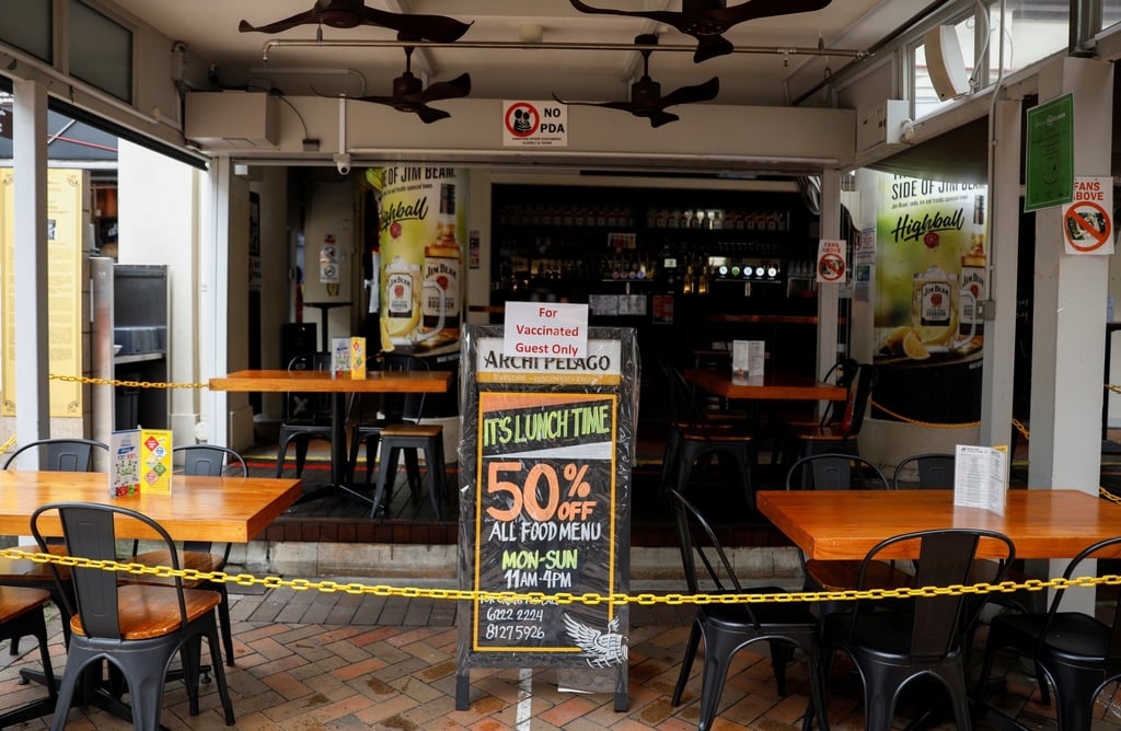 A sign in a pub in Singapore’s Chinatown that says “For Vaccinated Guests Only”. Photo: Reuters