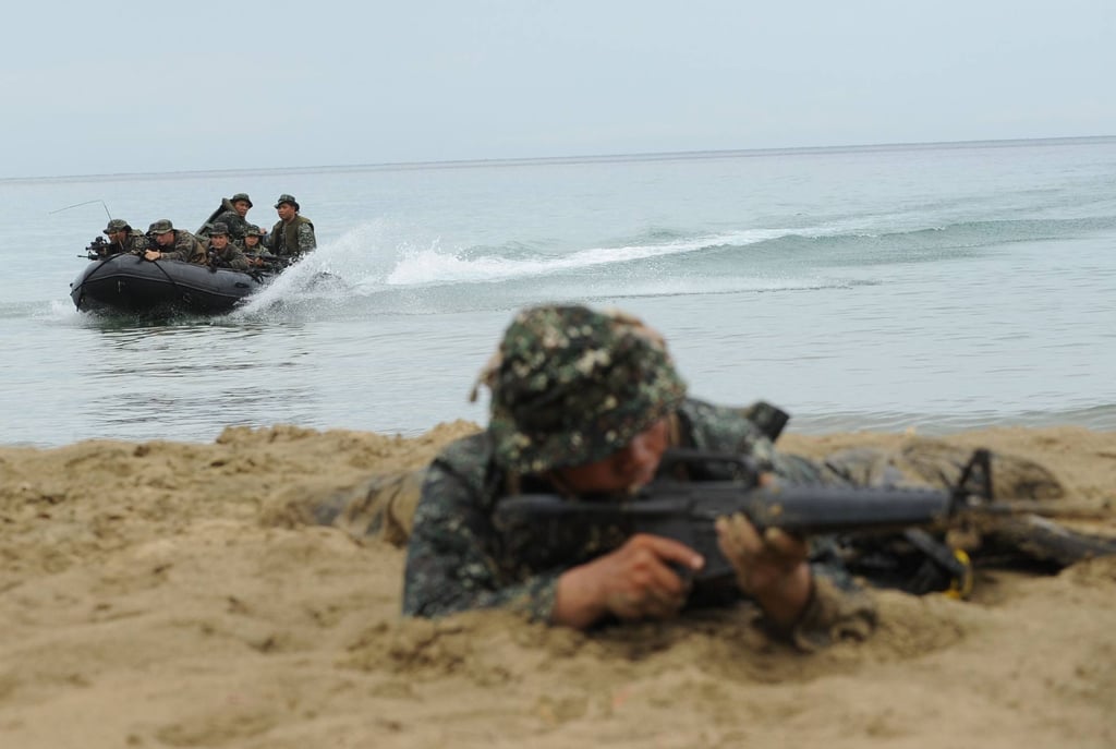 A Philippine marine takes part in a joint exercise with US troops. Photo: AFP A Philippine marine takes part in a joint exercise with US troops. Photo: AFP