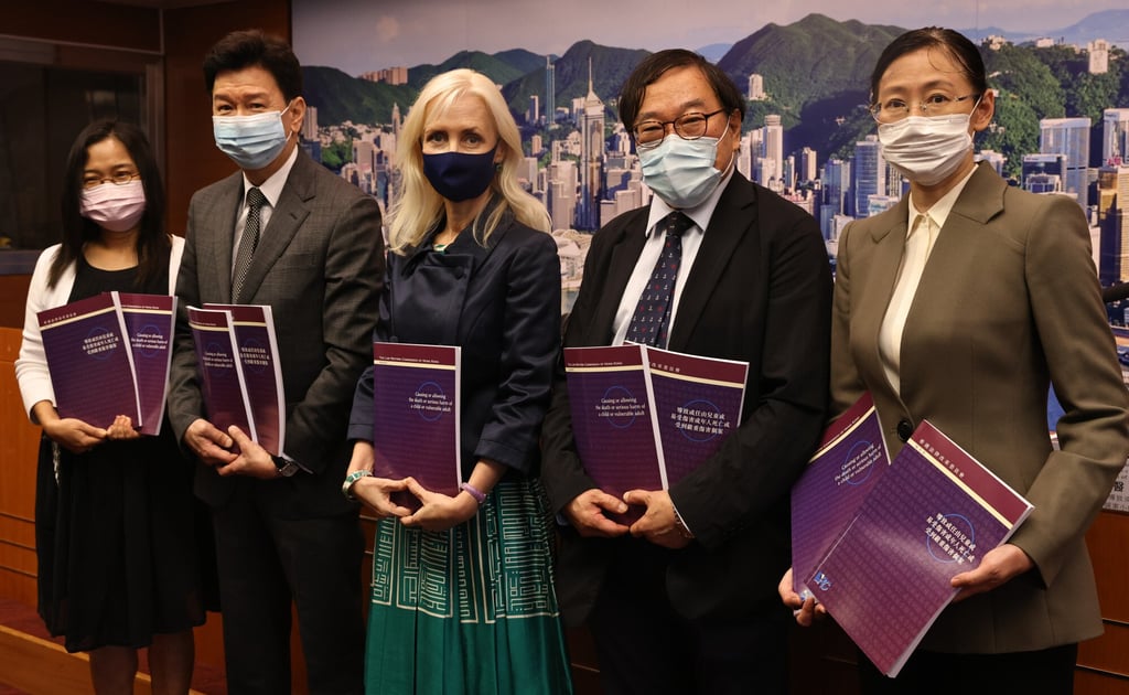 (From left) Adeline Wan, secretary of the Law Reform Commission, Stephen Hung, commission member, Amanda Whitfort, chairperson of the subcommittee on causing or allowing the death of a child or vulnerable adult, Dr Philip Beh, member of the subcommittee, and Louisa Ng, secretary to the subcommittee, at the press conference on the release of the subcommittee’s report on September 10. Photo: K.Y. Cheng