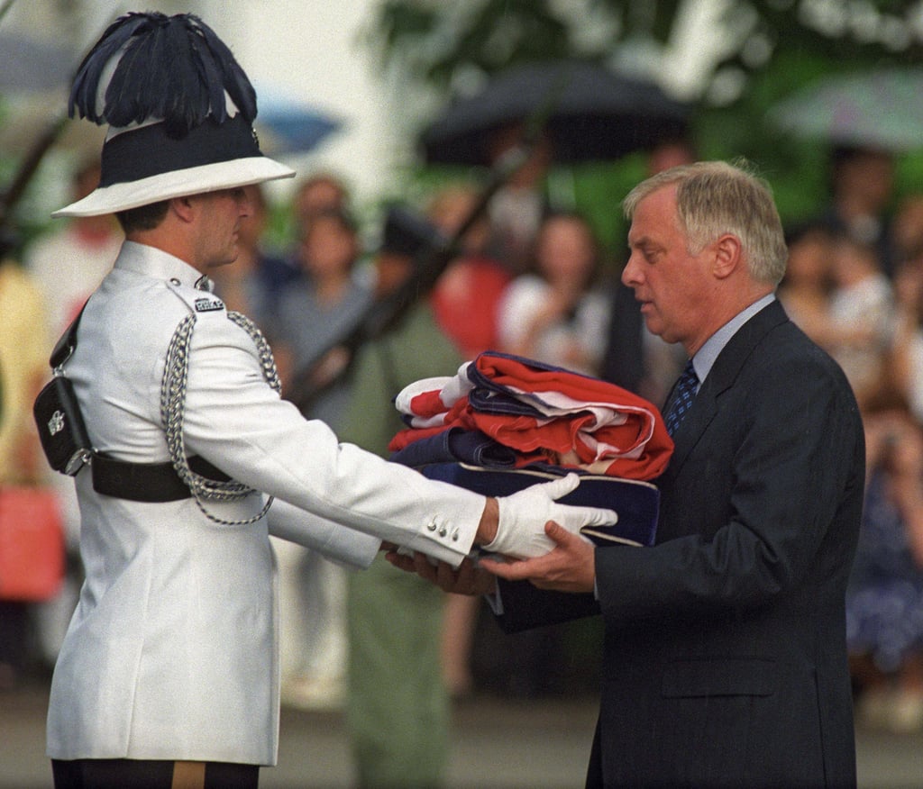 Chris Patten, the last governor of Hong Kong, receiving the Union flag flag during a farewell ceremony at Government House on June 30,1997. Photo: AFP