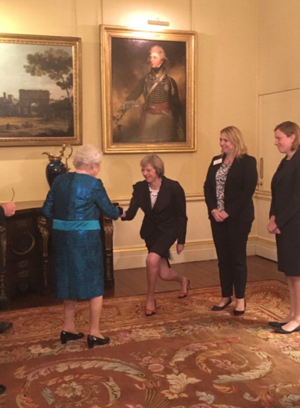 People have joked that Theresa May’s curtsies are awkward yet hilarious. Photo: @iamamoum/Twitter