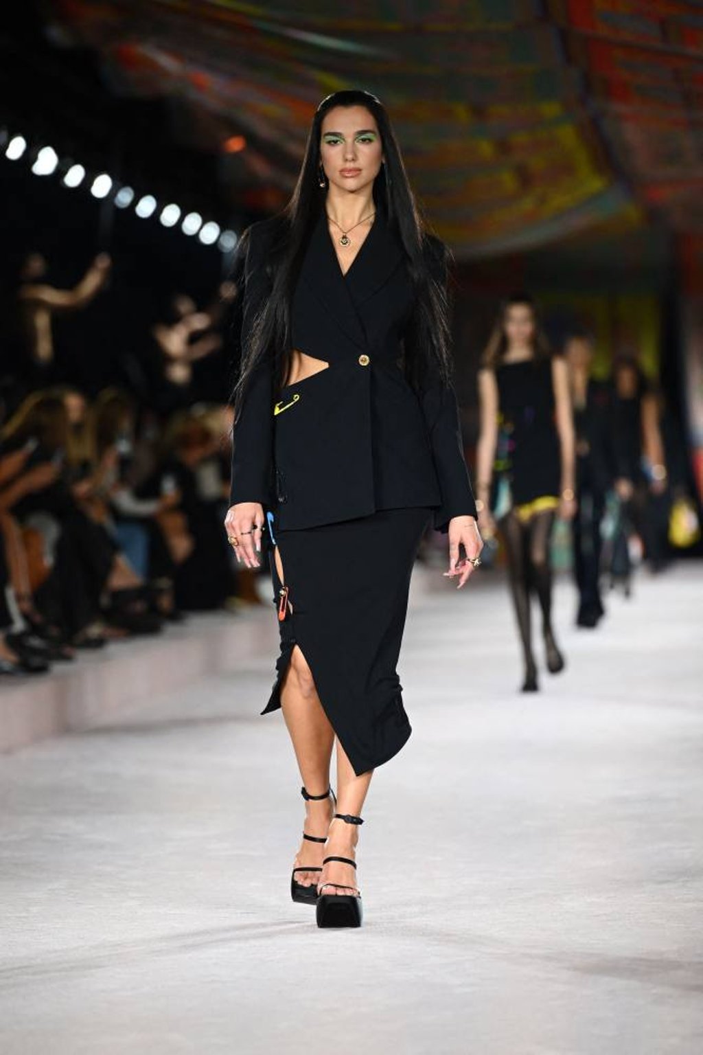British singer and model Dua Lipa presents a creation for Versace’s women’s spring/summer 2022 collection during the Fashion Week in Milan, on September 24. Photo: AFP