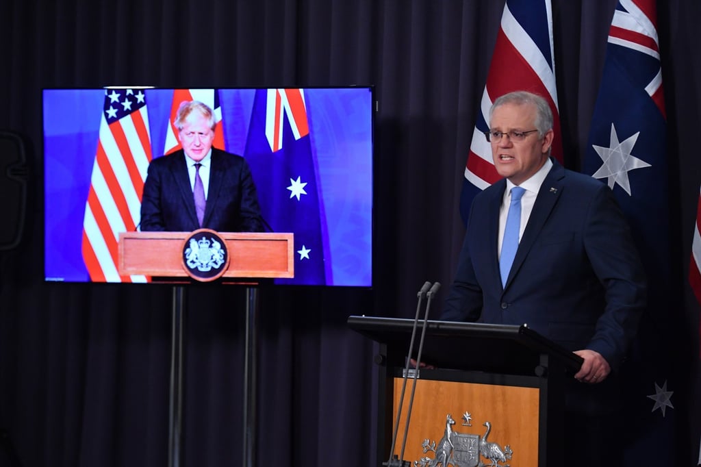 Australian Prime Minister Scott Morrison attends a joint press conference via audio visual link with Britain’s Prime Minister Boris Johnson (on screen) and US President Joe Biden (unseen) on September 16, 2021, to announce the creation of a trilateral security partnership to be known as Aukus. Photo: EPA-EFE