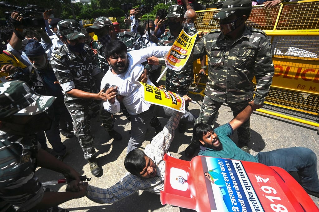 Police detain activists from the Indian Youth Congress party during a protest against the government after prices were raised for petrol, diesel and liquefied petroleum gas, in New Delhi on September 2. Photo: AFP