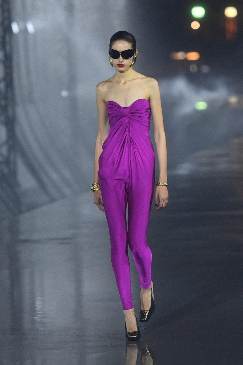 A model presents a creation by Yves Saint Laurent near the Eiffel Tower during the womenswear spring/summer 2022 collection show in Paris on September 28, during Paris Fashion Week. Photo: AFP A model presents a creation by Yves Saint Laurent near the Eiffel Tower during the womenswear spring/summer 2022 collection show in Paris on September 28, during Paris Fashion Week. Photo: AFP