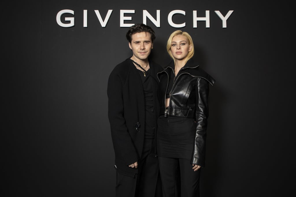Brooklyn Beckham and Nicola Peltz pose for photographers before the Givenchy spring/summer 2022 ready-to-wear fashion show presented in Paris, on October 3. Photo: Invision/AP