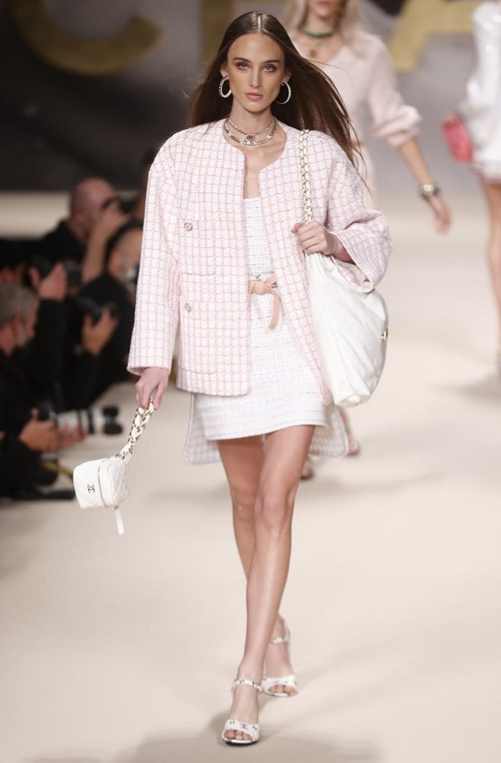 Models present creations from the spring/summer 2022 ready-to-wear collection by French designer Virginie Viard for fashion house Chanel during Paris Fashion Week, in Paris, France, on October 5. Photo: EPA-EFE