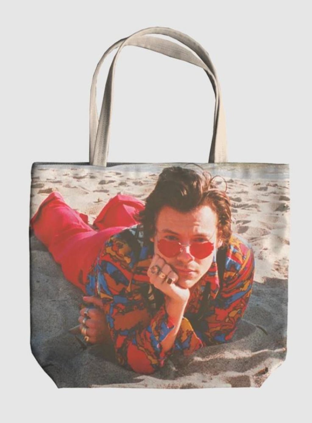 The Watermelon Sugar tote is printed with a picture of Harry Styles in the song’s music video. Photo: shopus.hstyles.co.uk The Watermelon Sugar tote is printed with a picture of Harry Styles in the song’s music video. Photo: shopus.hstyles.co.uk