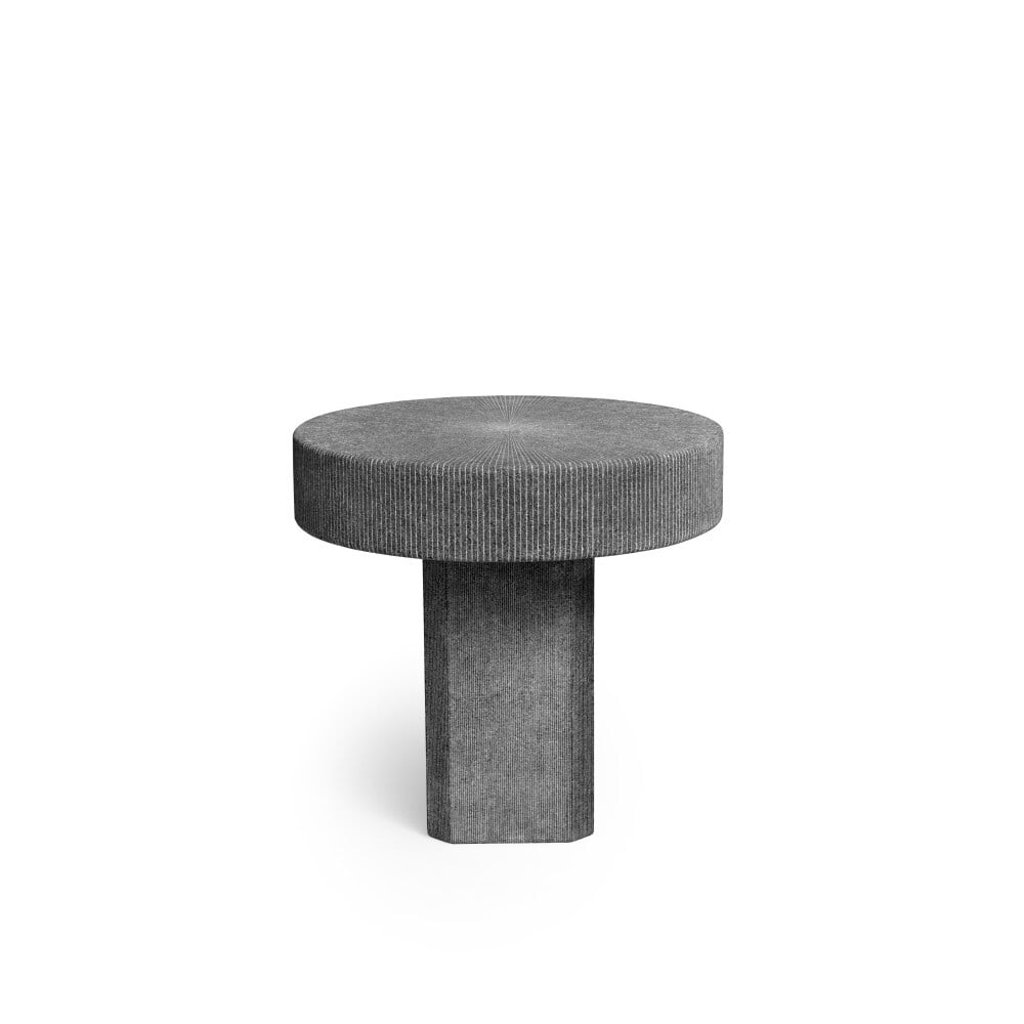 The Lignage d’Hermes stone table begins life black but turns white when engraved. Photo: Hermès The Lignage d’Hermes stone table begins life black but turns white when engraved. Photo: Hermès