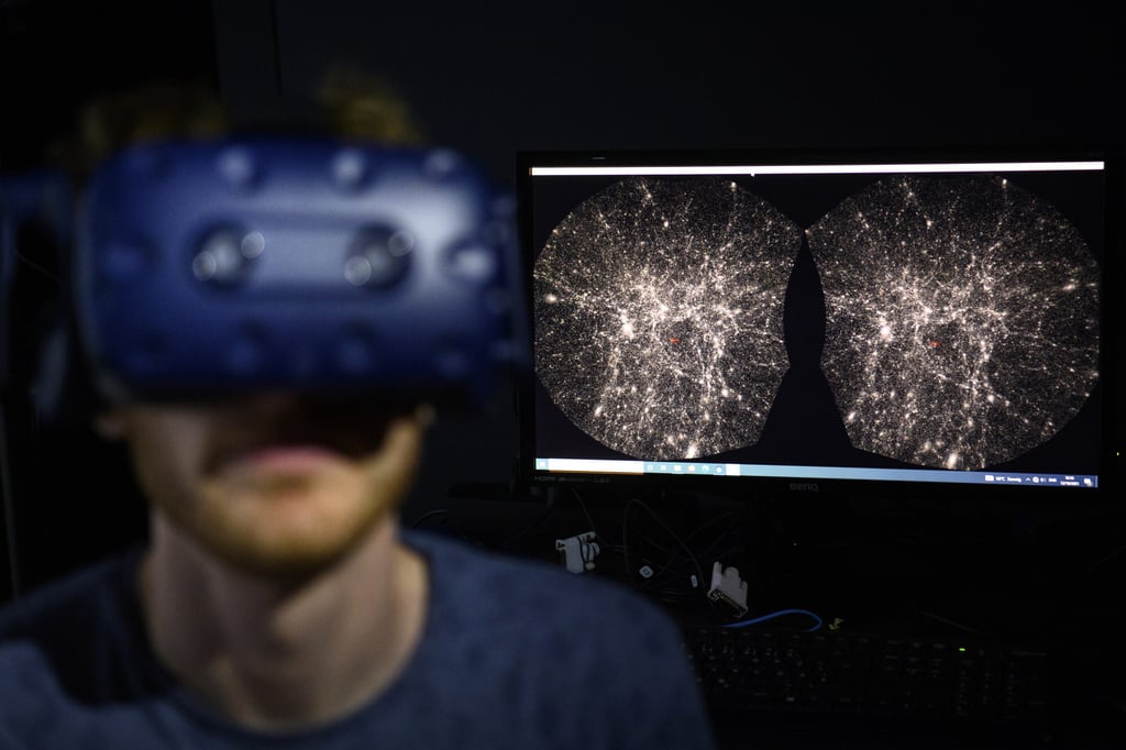 A software engineer explores, with a virtual reality headset, the most detailed 3D map of the universe with the virtual reality software Virup – Virtual Reality Universe Project – developed by the Swiss Federal Institute of Technology. Photo: AP
