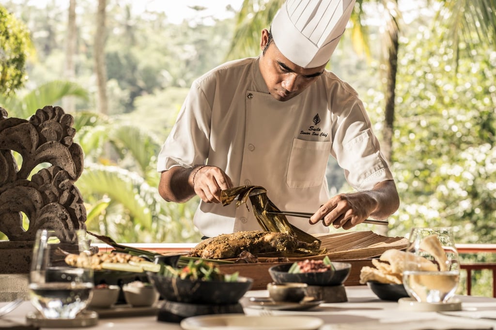 Chef Suta carving a roasted duck. Chef Suta carving a roasted duck.