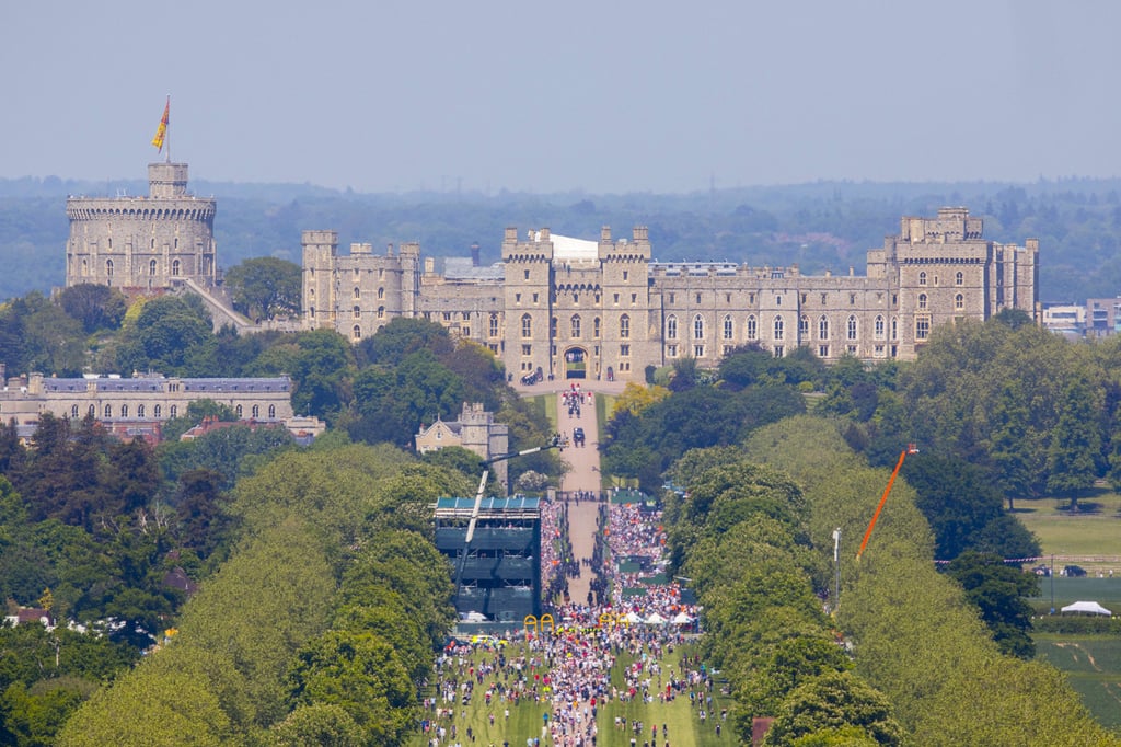 Crowds gathered down the Long Walk at Windsor Castle to watch a procession following the wedding of Meghan Markle and Prince Harry on May 2018 in Windsor, England. Photo: PA Wire/Abaca Press/TNS
