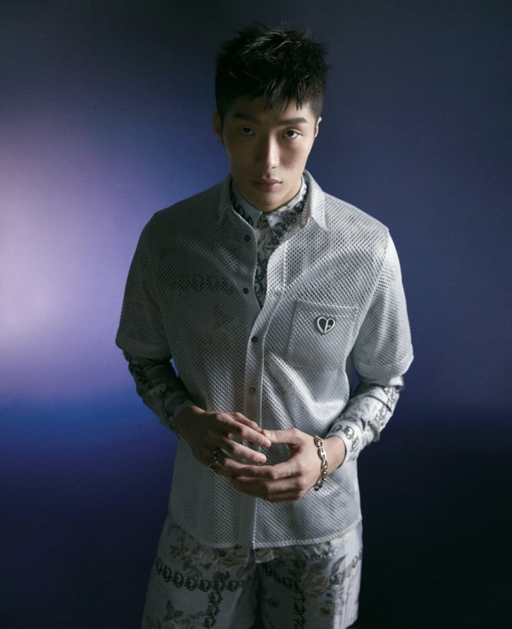 Cheung in white short-sleeve shirt (HK$7,600), long-sleeve shirt (HK$19,000), shorts (HK$15,000), rings and bracelet by Dior Men.
