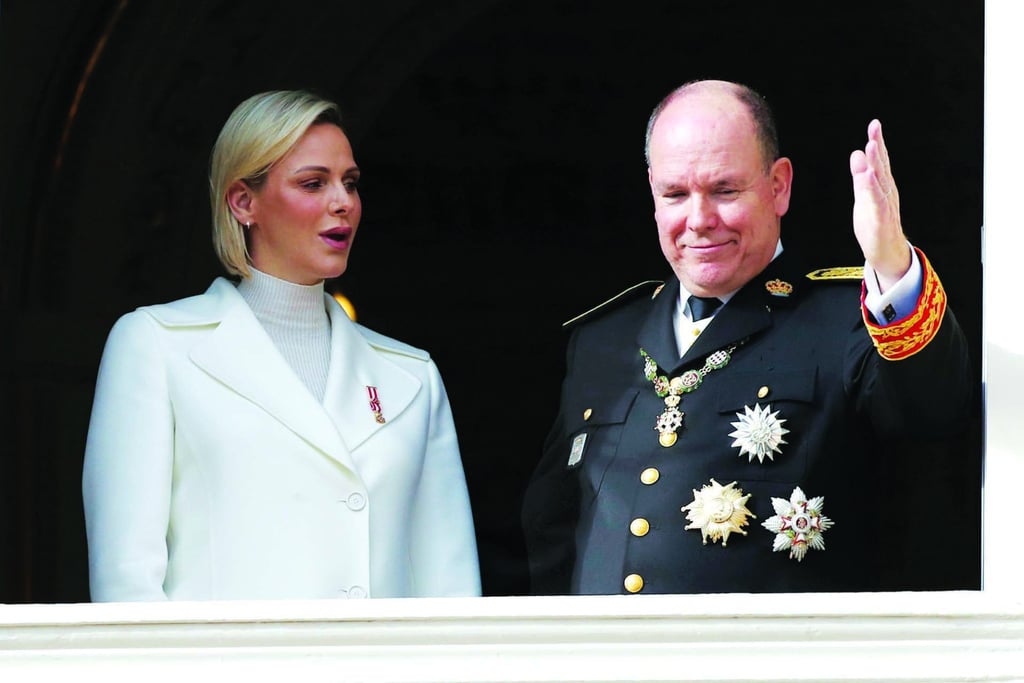 Prince Albert of Monaco with his wife Princess Charlene wave from the balcony during the ceremony marking the National Day in Monaco in November 2019. Photo: AP Photo Prince Albert of Monaco with his wife Princess Charlene wave from the balcony during the ceremony marking the National Day in Monaco in November 2019. Photo: AP Photo