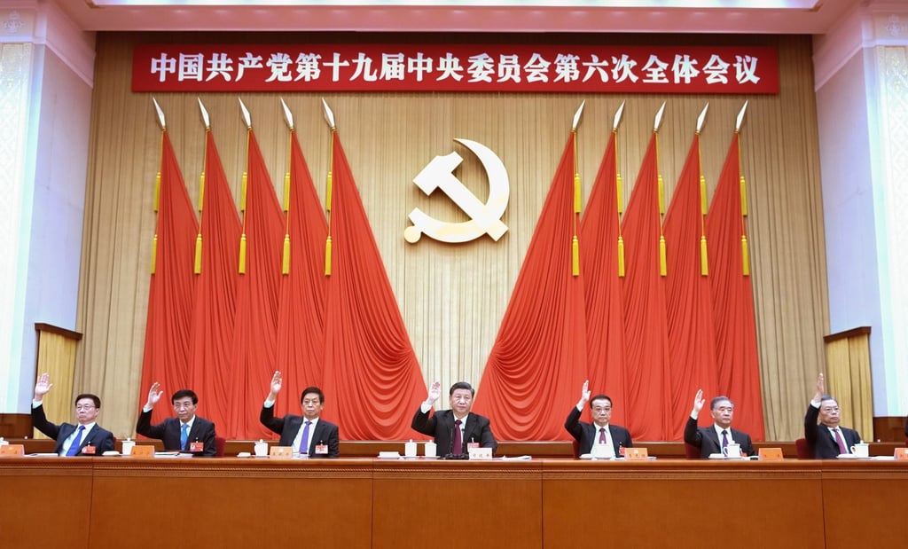 Chinese President Xi Jinping, centre, votes at the sixth plenum of the Communist Party’s 19th Central Committee alongside other committee members. Photo: EPA