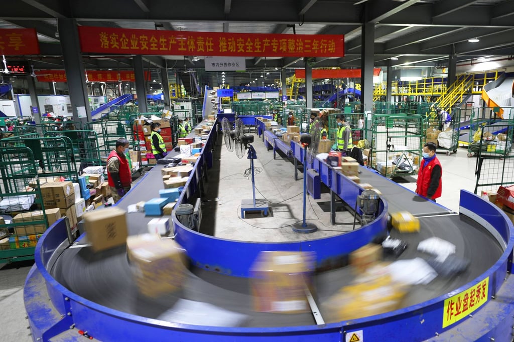 Workers sort packages at a logistics firm in Hunan province, China. Photo: AFP Workers sort packages at a logistics firm in Hunan province, China. Photo: AFP