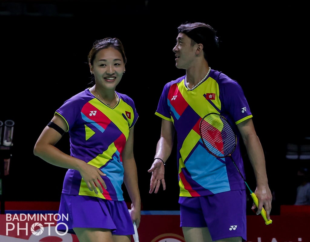 Tse Ying-suet smiles with Tang Chun-man after winning a point against their South Korean rivals. Photo: Badminton Photo