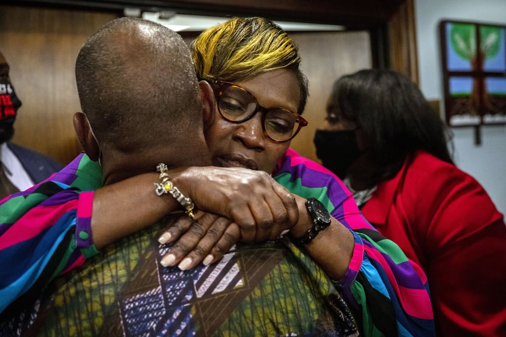 Ahmaud Arbery’s mother, Wanda Cooper-Jones, is hugged by a supporter after the jury convicted three men on Wednesday over her son’s killing. Photo: TNS