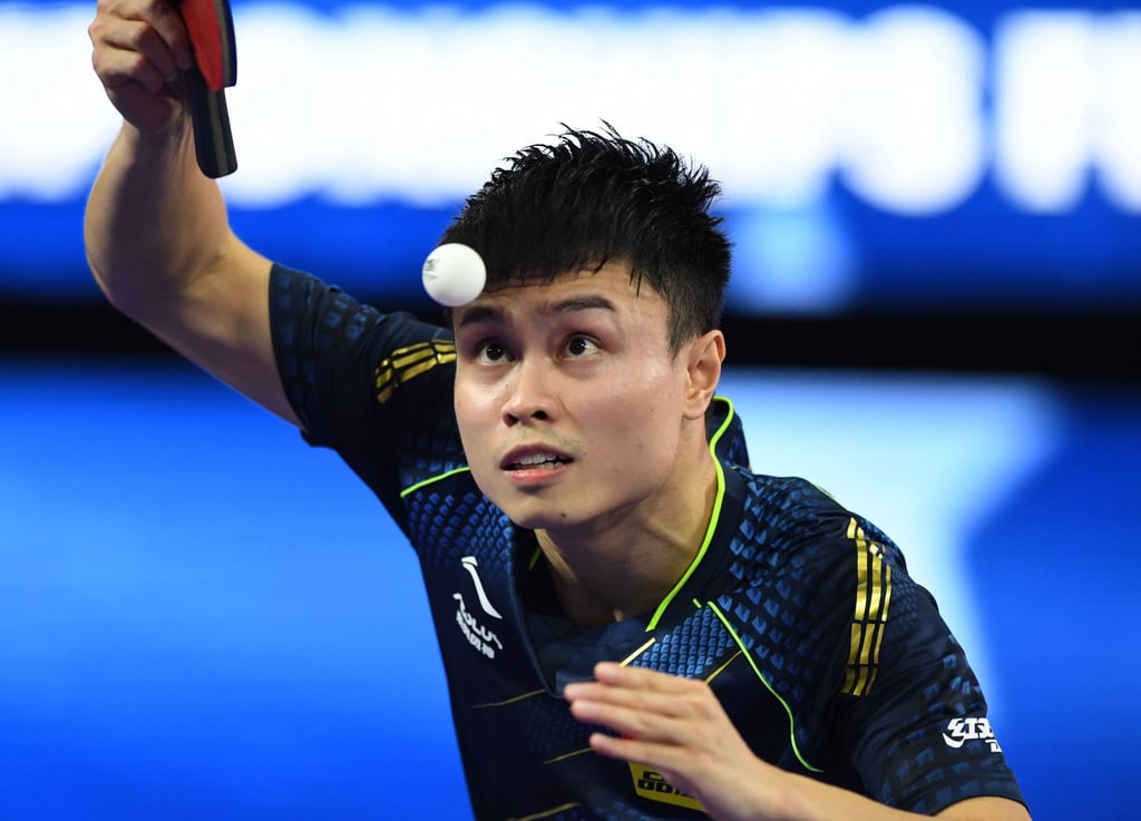 Zhou Qihao serves to Timo Boll. Photo: Xinhua