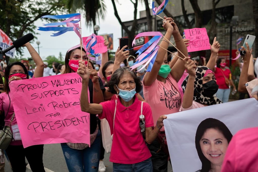 Supporters of Leni Robredo cheer as she arrives to file her candidacy for president, in Pasay City, Metro Manila, Philippines. Photo: Reuters
