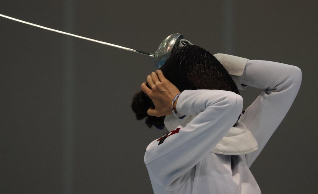 Vivian Kong Man-wai adjusts her equipment during the Hong Kong Open women’s épée final. Photo: May Tse