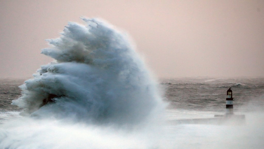 Waves crash against the pier wall at Seaham Lighthouse in northern England during Storm Arwen. Photo: Reuters Waves crash against the pier wall at Seaham Lighthouse in northern England during Storm Arwen. Photo: Reuters