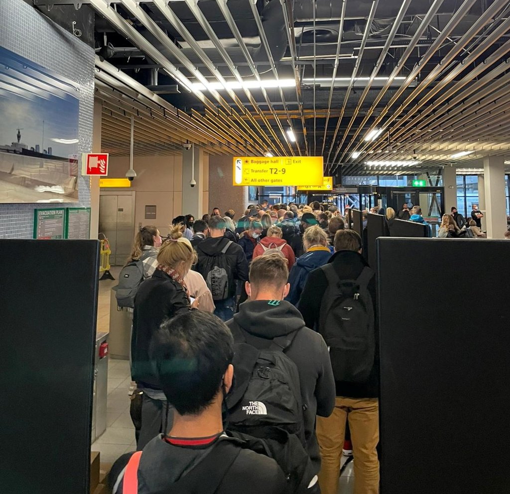 Passengers travelling from South Africa queue to be tested for Covid-19 after being held on the tarmac at Schiphol Airport in the Netherlands on November 25. Photo: Social media via Reuters Passengers travelling from South Africa queue to be tested for Covid-19 after being held on the tarmac at Schiphol Airport in the Netherlands on November 25. Photo: Social media via Reuters