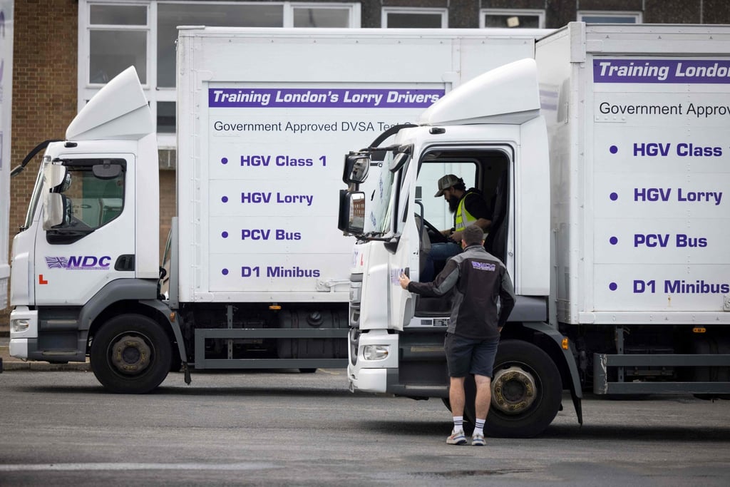 A learner driver and instructor prepare for an HGV driving test at a centre in south London. Britain is facing a shortage of HGV drivers. Photo: AFP