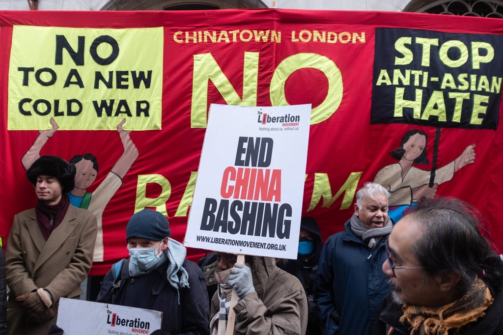 Pro-Beijing attendees hold placards during a rally in London’s Chinatown on Saturday. Photo: Getty Images Pro-Beijing attendees hold placards during a rally in London’s Chinatown on Saturday. Photo: Getty Images