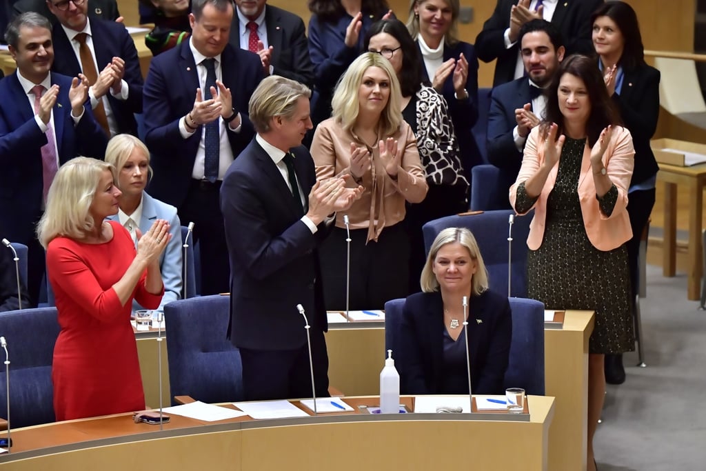 Social Democratic Party leader Magdalena Andersson sits as she is applauded after being appointed prime minister. Photo: AP
