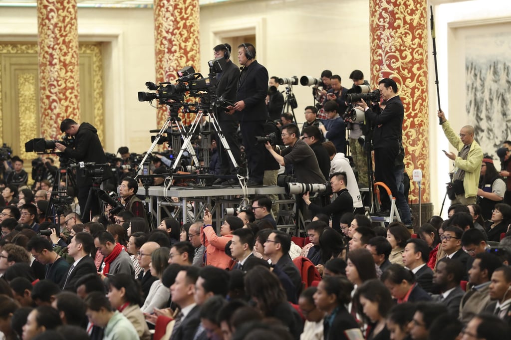 Journalists work at a Beijing press conference in March 2019. Photo: Xinhua Journalists work at a Beijing press conference in March 2019. Photo: Xinhua