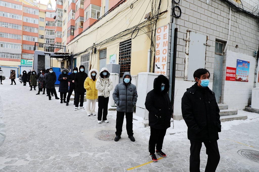 Residents line up for mass Covid-19 testing following new cases in Manzhouli, Inner Mongolia autonomous region, on November 29. Photo: cnsphoto via Reuters