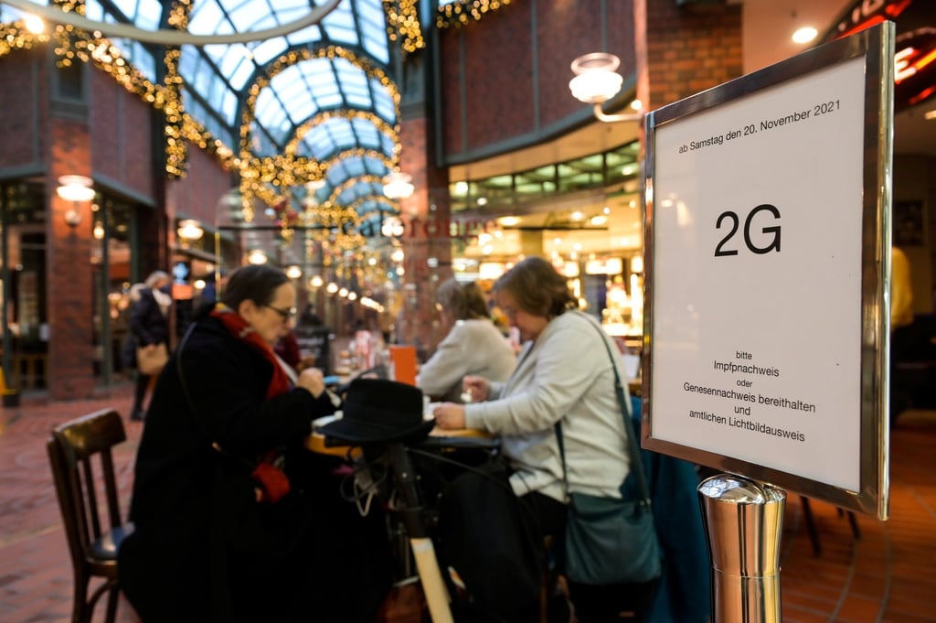 People at a shopping centre in Germany whose government backs mandatory Covid-19 vaccination. Photo: Reuters People at a shopping centre in Germany whose government backs mandatory Covid-19 vaccination. Photo: Reuters