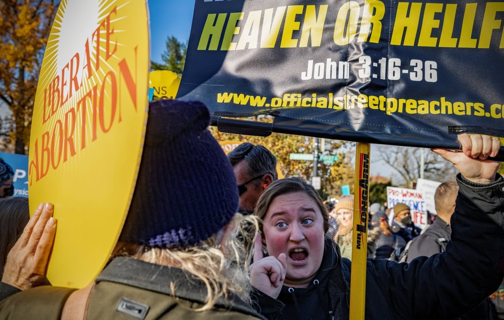 An anti-abortion activist (right) argues with a pro-abortion rights activist outside the US Supreme Court on Wednesday. Photo: Reuters