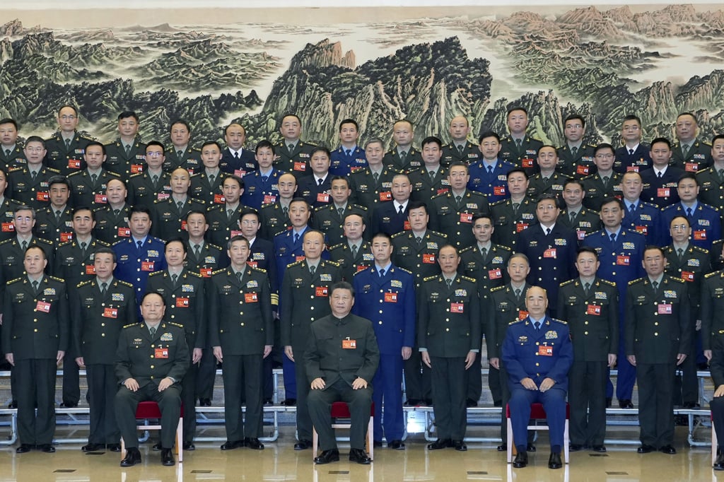 Chinese President Xi Jinping (centre) poses for photos with representatives attending a conference on military-talent-related work in Beijing, China on November 26. Photo: Xinhua via AP Chinese President Xi Jinping (centre) poses for photos with representatives attending a conference on military-talent-related work in Beijing, China on November 26. Photo: Xinhua via AP